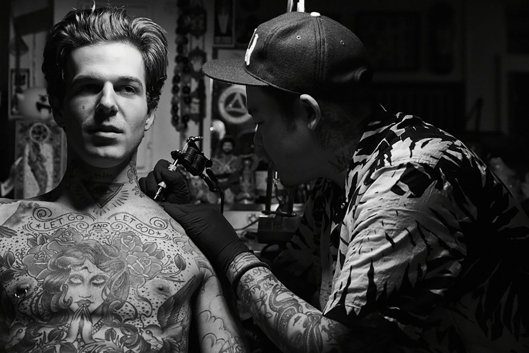 Dr. Woo (Brian Woo) while tattooing, photographed by Andrew Arthur, via Hyperbeast