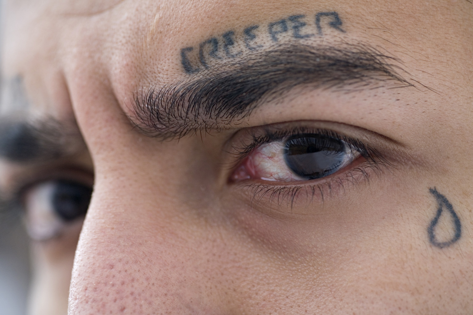 Portrait of Jose Regalado showing his tear tattoo, source: GettyImages