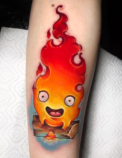 New school tattoo depicting Calcifer from Studio Ghibli