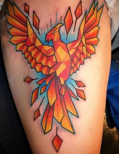Colourful geometric phoenix tattoo by @molinartattoos