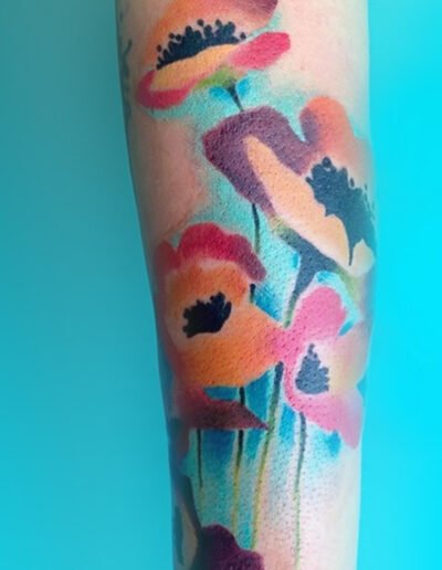 Watercolour tattoo of poppies by Briana Sargent @briana_buju_tattoo