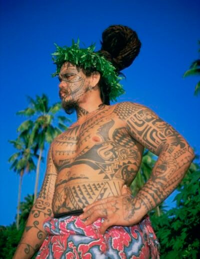 A man with a Marquesan tattoo, French Polynesia, leeward islands archipelago, island of Moorea, photo by Sylvain Grandadam, via Univers Voyage (universvoyage.com)