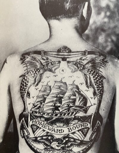 Anonymous photograph of a man with a tall ship tattoo from Heavily Tattooed Men And Women by Spider Webb, McGraw Hill, 1976.