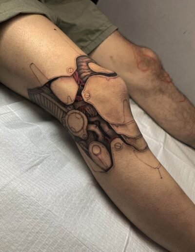 Biomechanical knee tattoo by Eddie Bird @eddiexbird