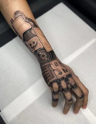 Biomechanical tattoo on hand (artist unknown) via Pinterest