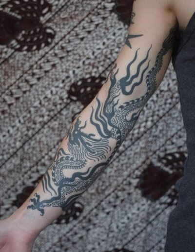 Black dragon tattoo (artist unknown) via Pinterest
