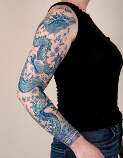 Blue dragon tattoo by Oozy @oozy_tattoo