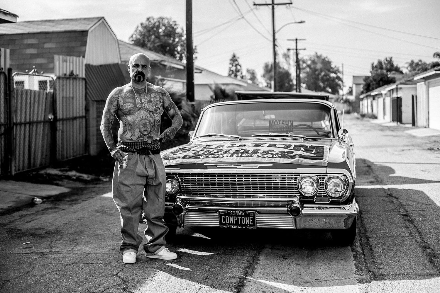 A man with Chicano tattoos documented by Julien Gremm @julien_gremm