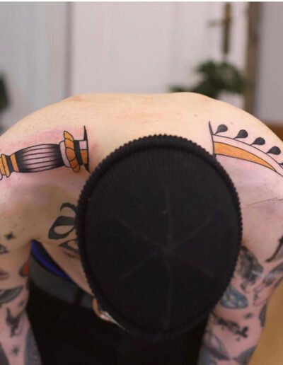 Dagger through neck tattoo (artist unknown)