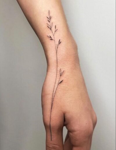 Fine line grass tattoo by Abuser Tattoo