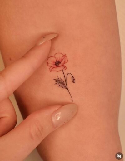Little poppy tattoo (artist unknown) via Pinterest