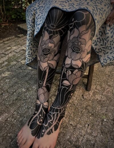 Floral blackwork leg tattoos by Gakkin @gakkinx