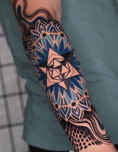 Geometric mandala tattoo by Raul Wesche @weschetattoo
