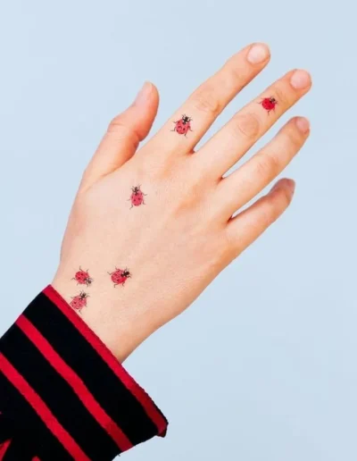 Ladybug tattoos (artist unknown) via Pinterest