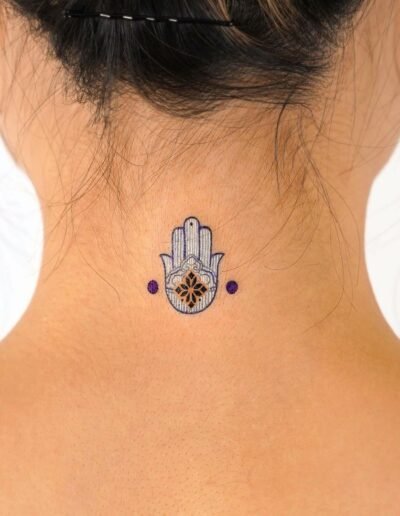 Micro hamsa tattoo by EQ @tattooist_eq