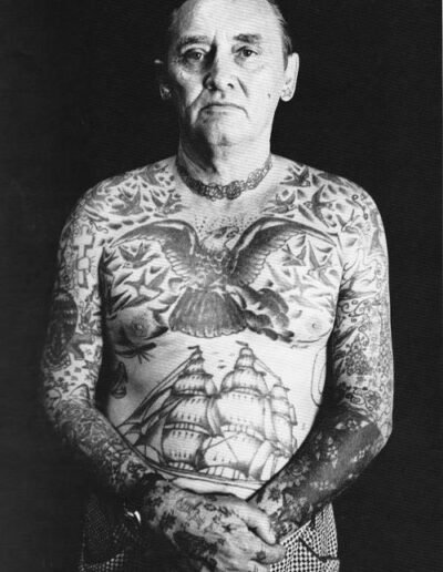 Old photo of a tattooed man, possibly a sailor (original source untrackable)