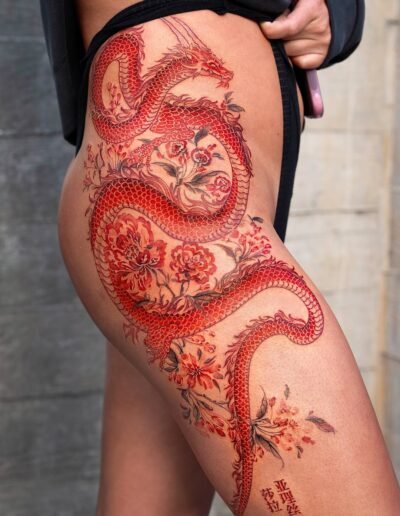 Red dragon tattoo by Oozy @oozy_tattoo