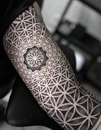 Geometric tattoo by Dana Shasho @danasha.tattoo